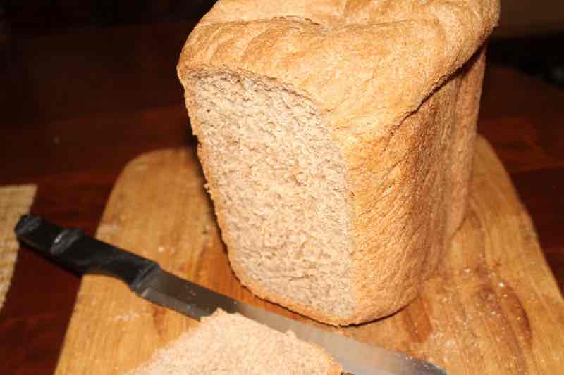 100pc sourdough loaf of bread that has been sliced. 100pc sourdough loaf of bread that has been sliced.