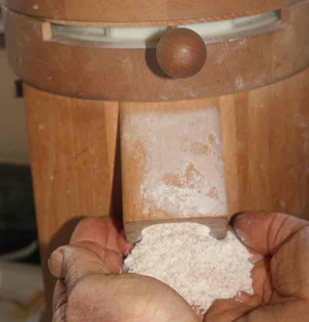 100pc wholemeal flour in hands. 100pc wholemeal flour in hands.