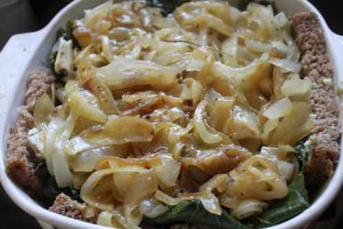 Adding French onions to the kale and blue cheese quiche Adding French onions to the kale and blue cheese quiche