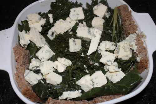 Adding kale and blue cheese to the quiche Adding kale and blue cheese to the quiche