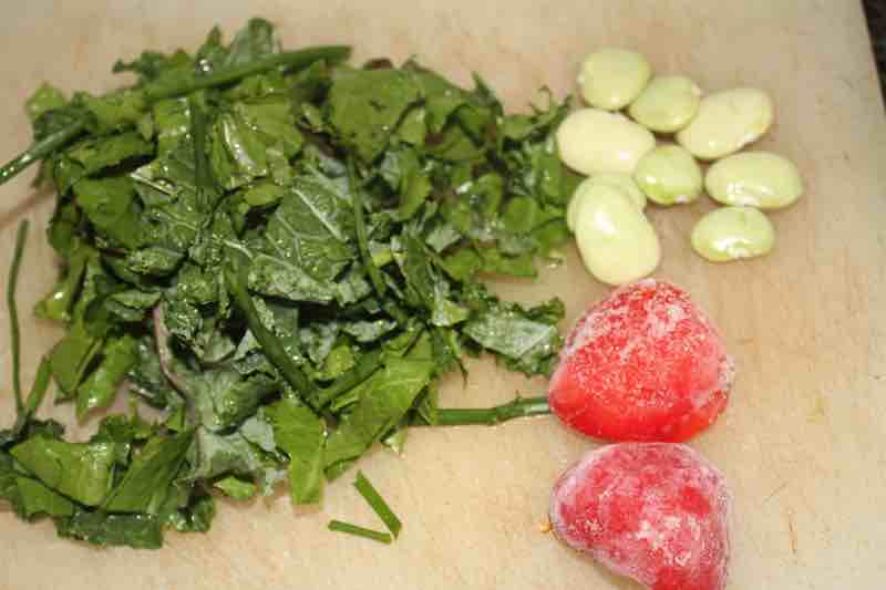 Assorted greens and chili for poached eggs on fried sourdough bread.