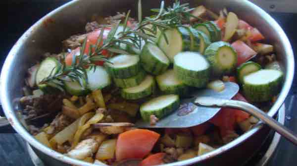 A photo of the bobotie vegetables in the pot. A photo of the bobotie vegetables in the pot.