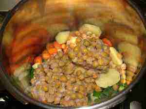 Chickpea soup ingredients in the pressure cooker. Chickpea soup ingredients in the pressure cooker.