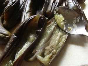 Adding garlic and chillies to your easy eggplant recipe.