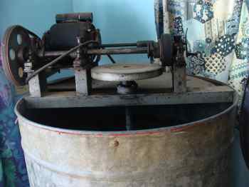 An electric honey extractor is very nice but you can start with a small hand-driven one.