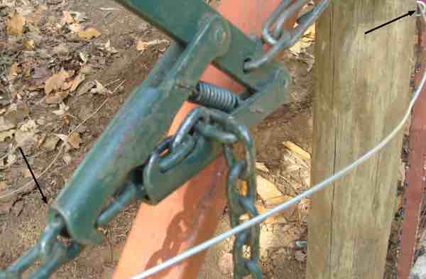 Fence puller latched on chain. Fence puller latched on chain.