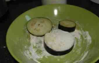 Eggplant slices in flour.