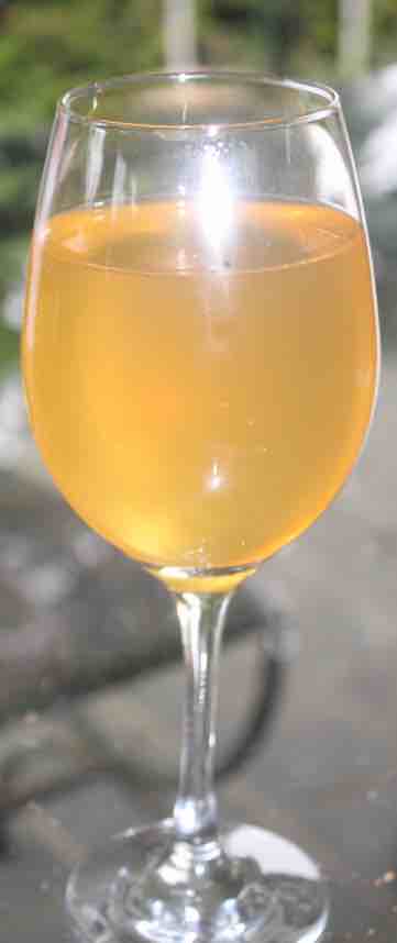 A glass of spicy peppadew mead. A glass of spicy peppadew mead.