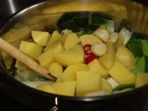 Ingredients for an Irish potato leek soup in the pot. Ingredients for an Irish potato leek soup in the pot.