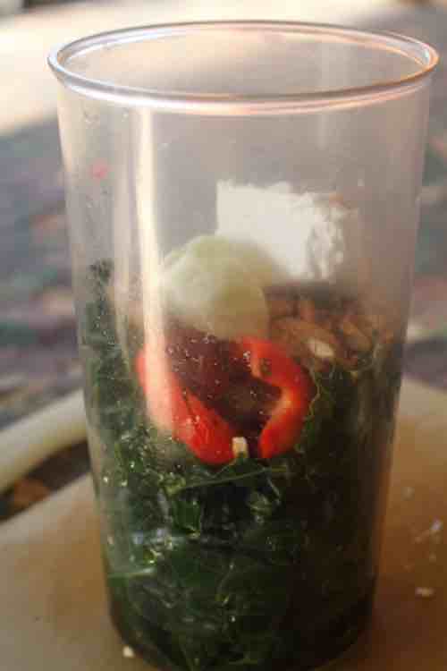 Kale pesto ingredients ready to be blended. Kale pesto ingredients ready to be blended.