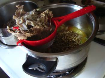 Remove the bones from the chicken bouillon for your lentil soup. Remove the bones from the chicken bouillon for your lentil soup.