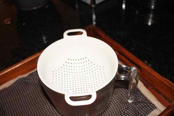 Plastic kefir funnel or colander.
