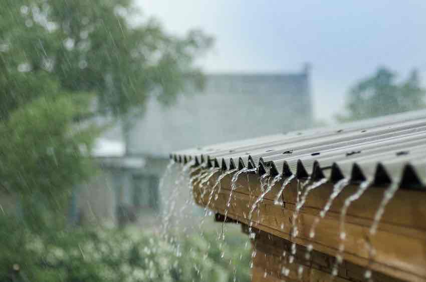 Rainwater running to waste with no gutters to collect it.