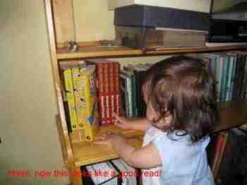 Bernard Preston's granddaughter fingering one of his books.