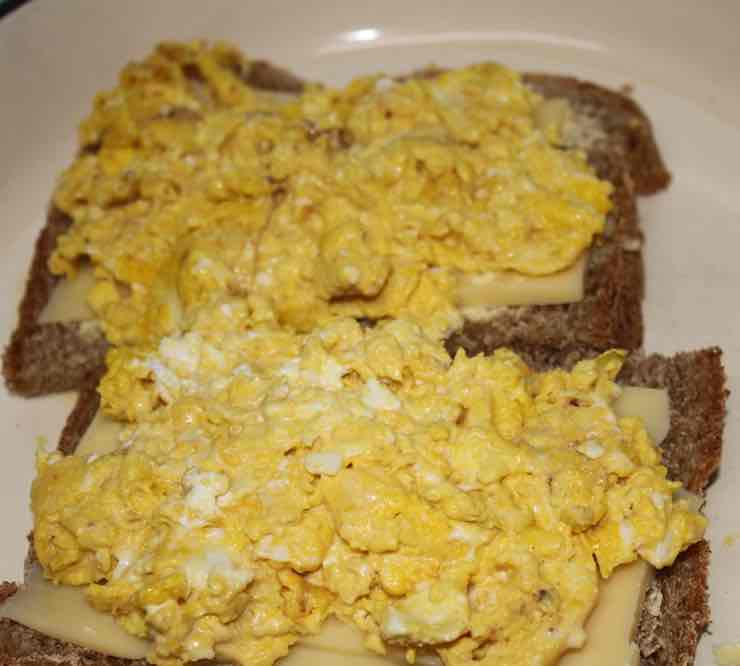 Scrambled eggs with cheese on toast. Scrambled eggs with cheese on toast.