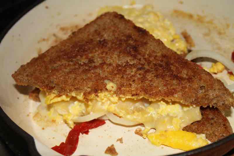 Scrambled eggs and cheese on wholewheat toast. Scrambled eggs and cheese on wholewheat toast.