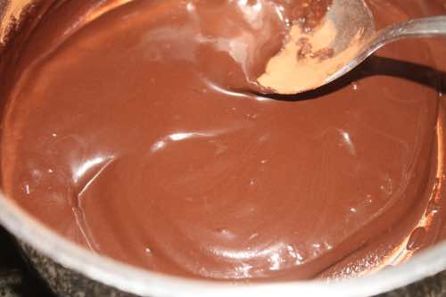 Stir cold water into the cocoa powder Stir cold water into the cocoa powder