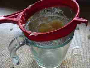 Straining lemon juice