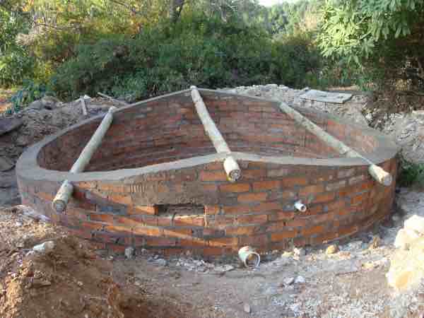 Underground reservoir made of bricks and mortar to store rainwater. Underground reservoir made of bricks and mortar to store rainwater.