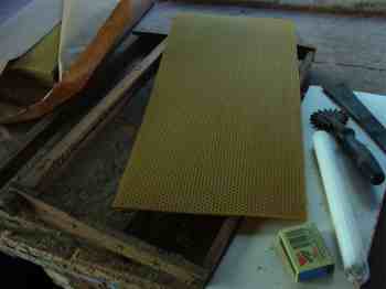 Waxing honeybee frames. Waxing honeybee frames.