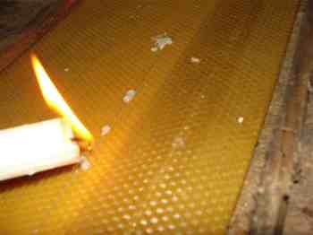 Securing the beeswax using a candle makes the frame more secure. Securing the beeswax using a candle makes the frame more secure.
