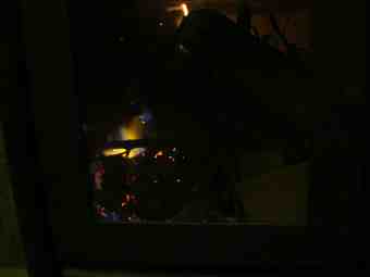 The woodstove flames after 1 minute.