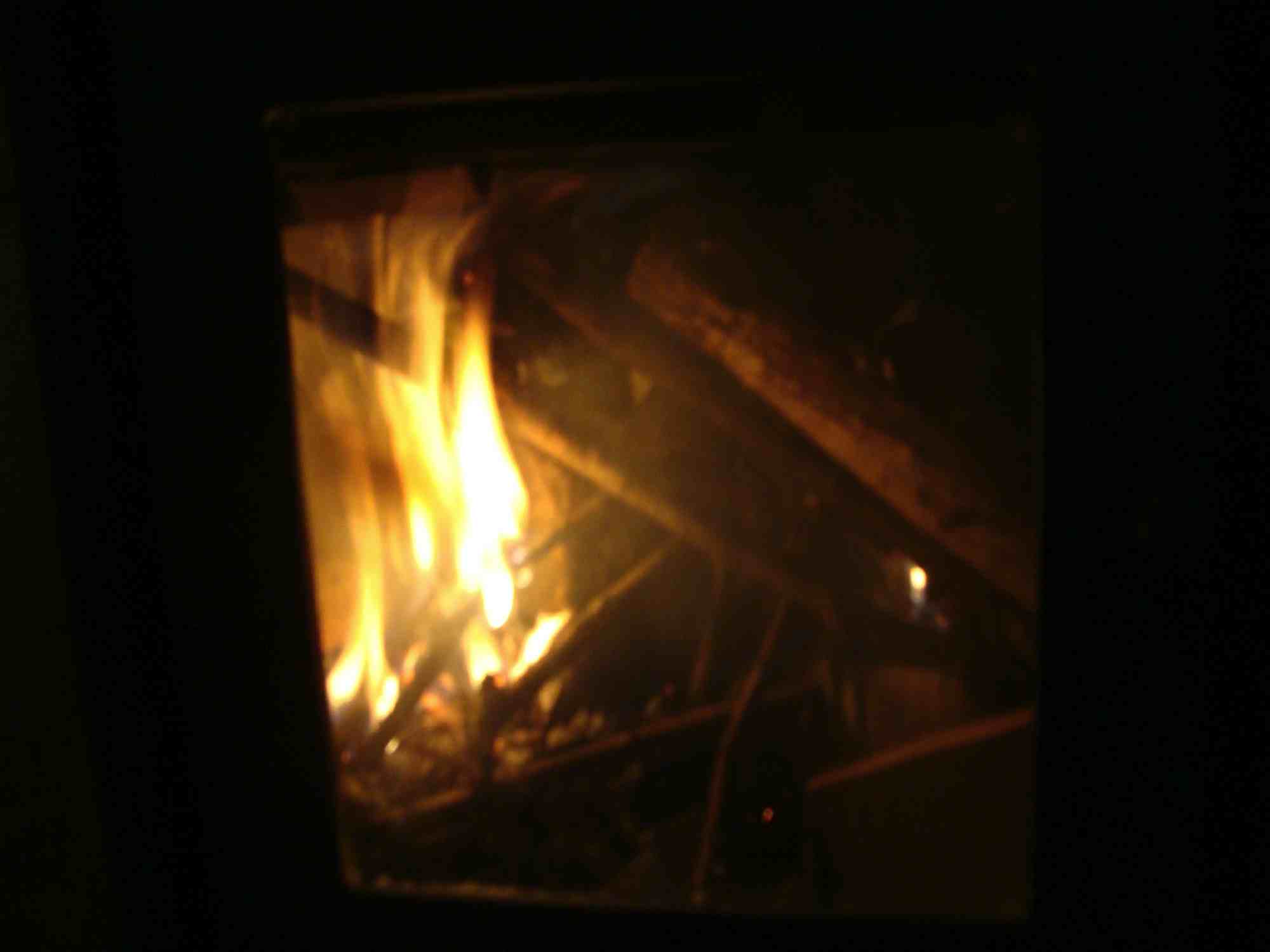 The woodstove flames after 3 minutes.