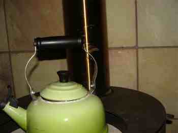 The woodstove stainless steel pipe and a kettle.