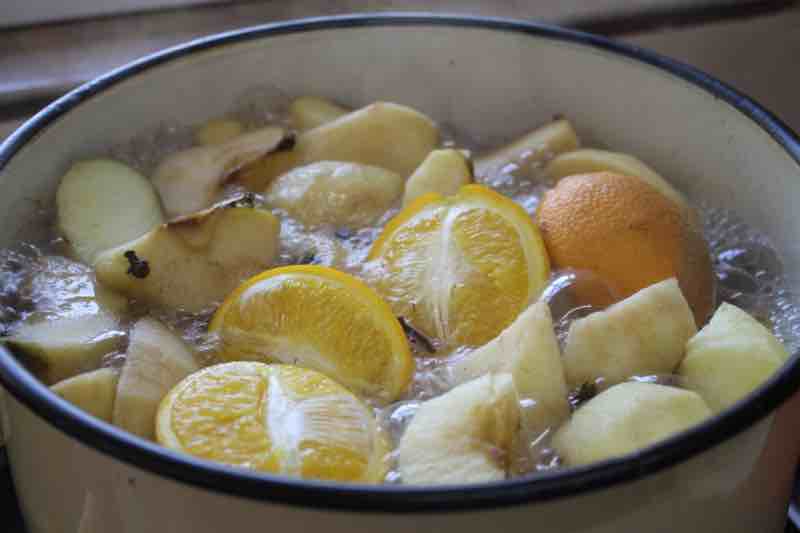 Making apple cider in a large pot.