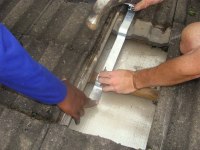 The solar tubes attachment to the roof prevents the whole water heater flying off into space in a high wind.