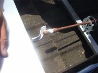 Solar tubes fitting tubes 1 shows applying the conduction paste to ensure good transfer of heat to the water in the manifold.