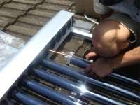 Solar tubes being fitted. Solar tubes being fitted.